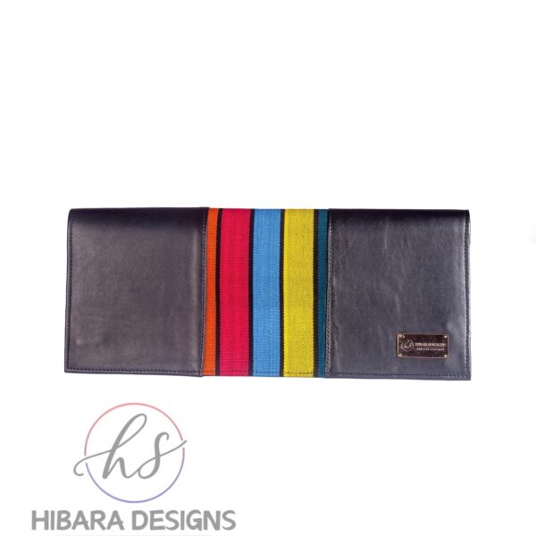 Our shangani bag is a leather clutch Bag Accented with Asooke