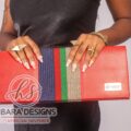 Our shangani bag is a leather clutch Bag Accented with Asooke