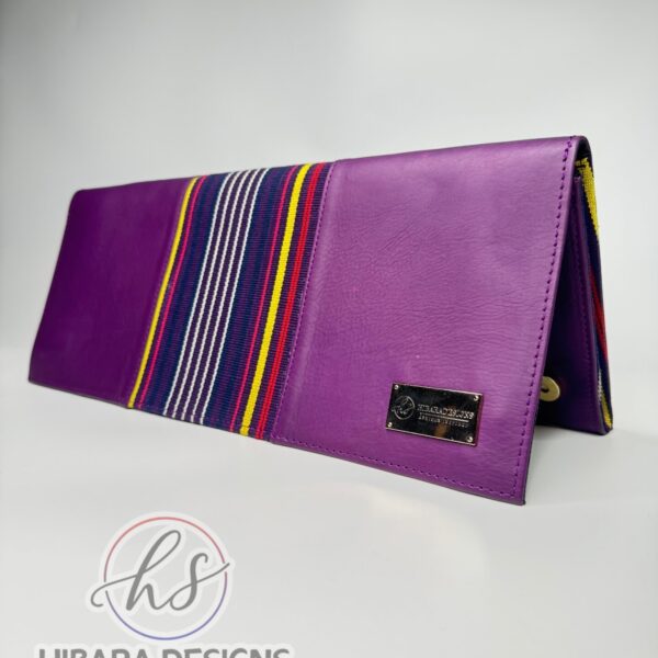 Our shangani bag is a leather clutch Bag Accented with Asooke