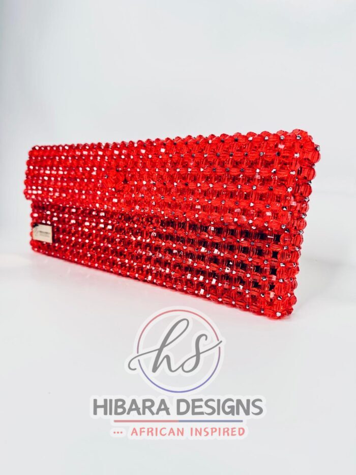 Introducing the Ooni Collection, your new favorite oversized clutch bag. She's bold, she's beautiful, she's BEADED, and most importantly, she sparkles when she enters the room, just like YOU! Handcrafted with love by female artisans from Lagos, Nigeria. Dimension:9x15 inches Material: Crystal Beads Interior: Satin-lined Your Efik bag is handcrafted specially, just for you! Due to the craftsmanship and time it takes to make each bag, please allow up to 2 to 4 weeks for your order to be shipped. Enjoy complimentary Priority 2 day shipping on U.S. orders! On your preorder items