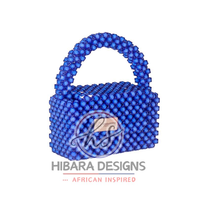 Introducing the Efik Collection, your new favorite IT bag She's bold, she's beautiful, she's BEADED, and most importantly, she sparkles when she enters the room, just like YOU! Handcrafted with love by female artisans from Lagos, Nigeria. Dimension: 7x10 inches Material: Blue Crystal Beads Interior: Satin-lined Your Efik bag is handcrafted specially, just for you! Due to the craftsmanship and time it takes to make each bag, please allow up to 2 to 4 weeks for your order to be shipped.