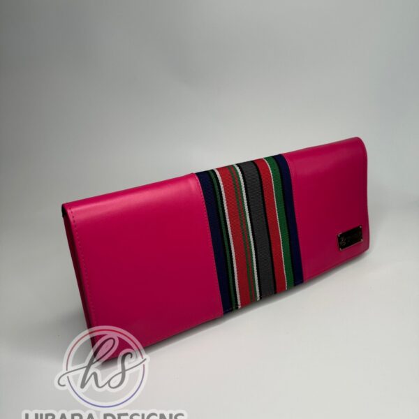 Our shangani bag is a leather clutch Bag Accented with Asooke