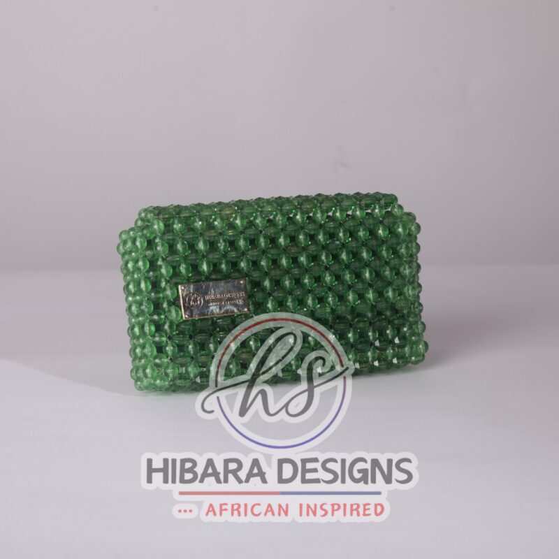 Introducing the Ooni Collection, your new favorite oversized clutch bag.& She's bold, she's beautiful, she's BEADED, and most importantly, she sparkles when she enters the room, just like YOU! Handcrafted with love by female artisans from Lagos, Nigeria. dimension, small: Material: pearls/ crystal/ glass beads Interior: Satin-lined Your Ooni bag is handcrafted specially, just for you! Due to the craftsmanship and time it takes to make each bag, please allow up to 2 to 4 weeks for your order to be shipped. Enjoy complimentary Priority 2 day shipping on U.S. orders! On your preorder items