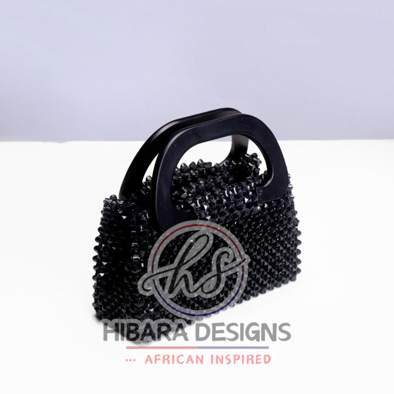 Introducing the Nzazai Collection, one of our exciting piece. This bag can be Dress up for brunch with the girls or weekend getaway with the man. She absolutely that IT bag needed to spice any outfit! Handcrafted with love by our young artisans of Accra, Ghana Interior:Satin-lined and inner pocket with zipper . This bag has inner flap with two magnetic claps for closure. Material: Beads Measurement: length-7 inches width - 11inches