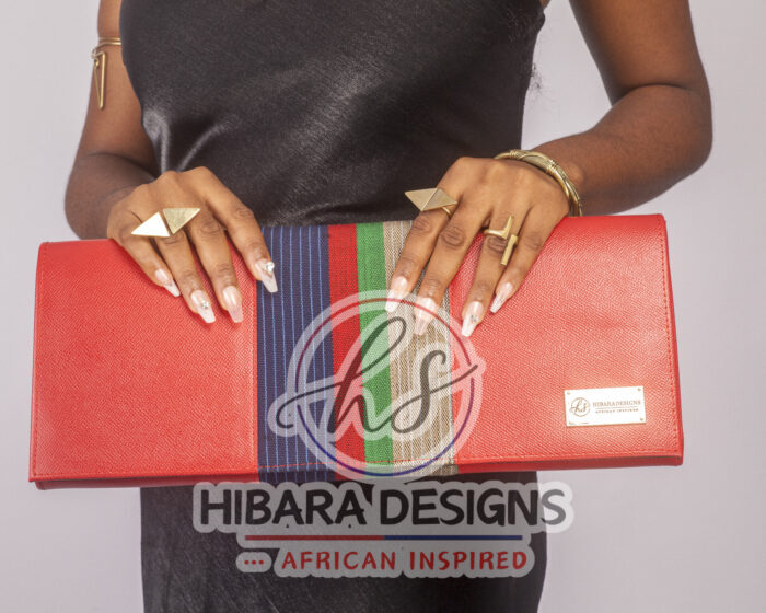 Our shangani bag is a leather clutch Bag Accented with Asooke