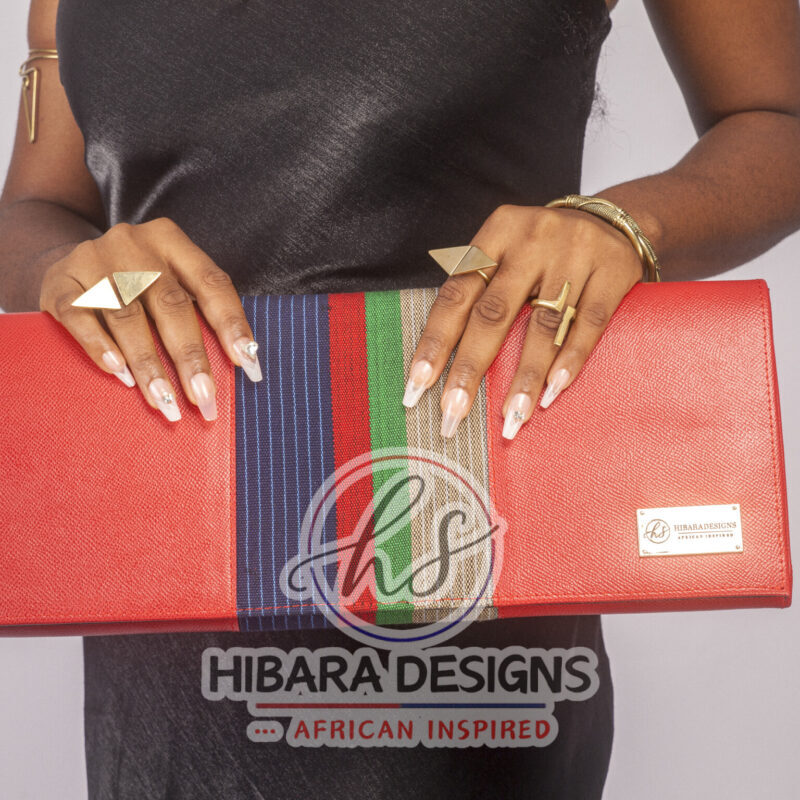 Our shangani bag is a leather clutch Bag Accented with Asooke